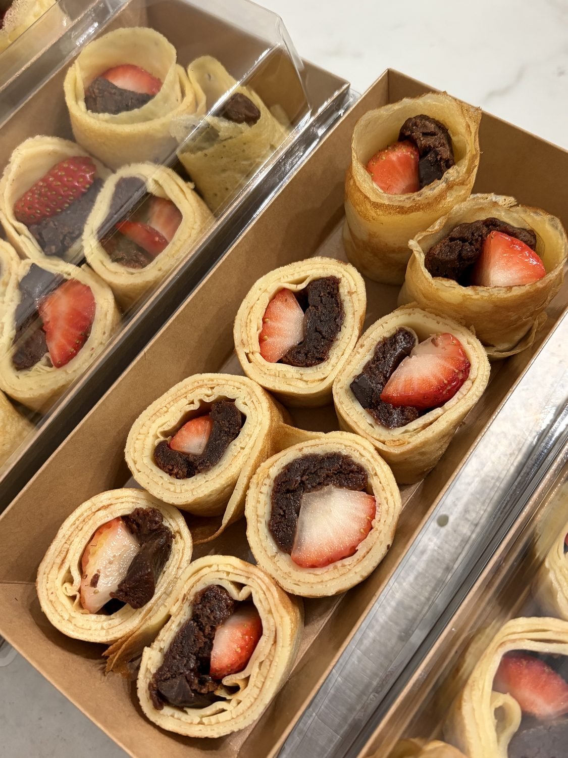 Brownie and strawberry crepe rolls